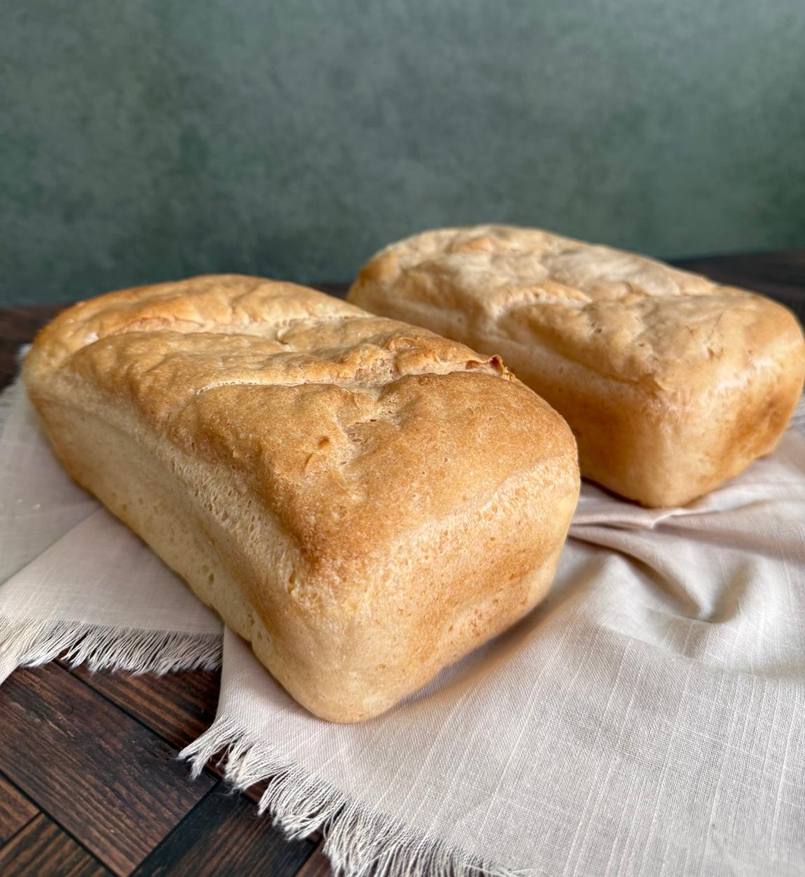 Two classic gluten-free loaves on linen