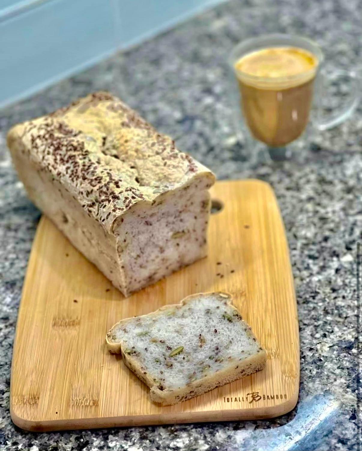 Seeded loaf and slice with coffee