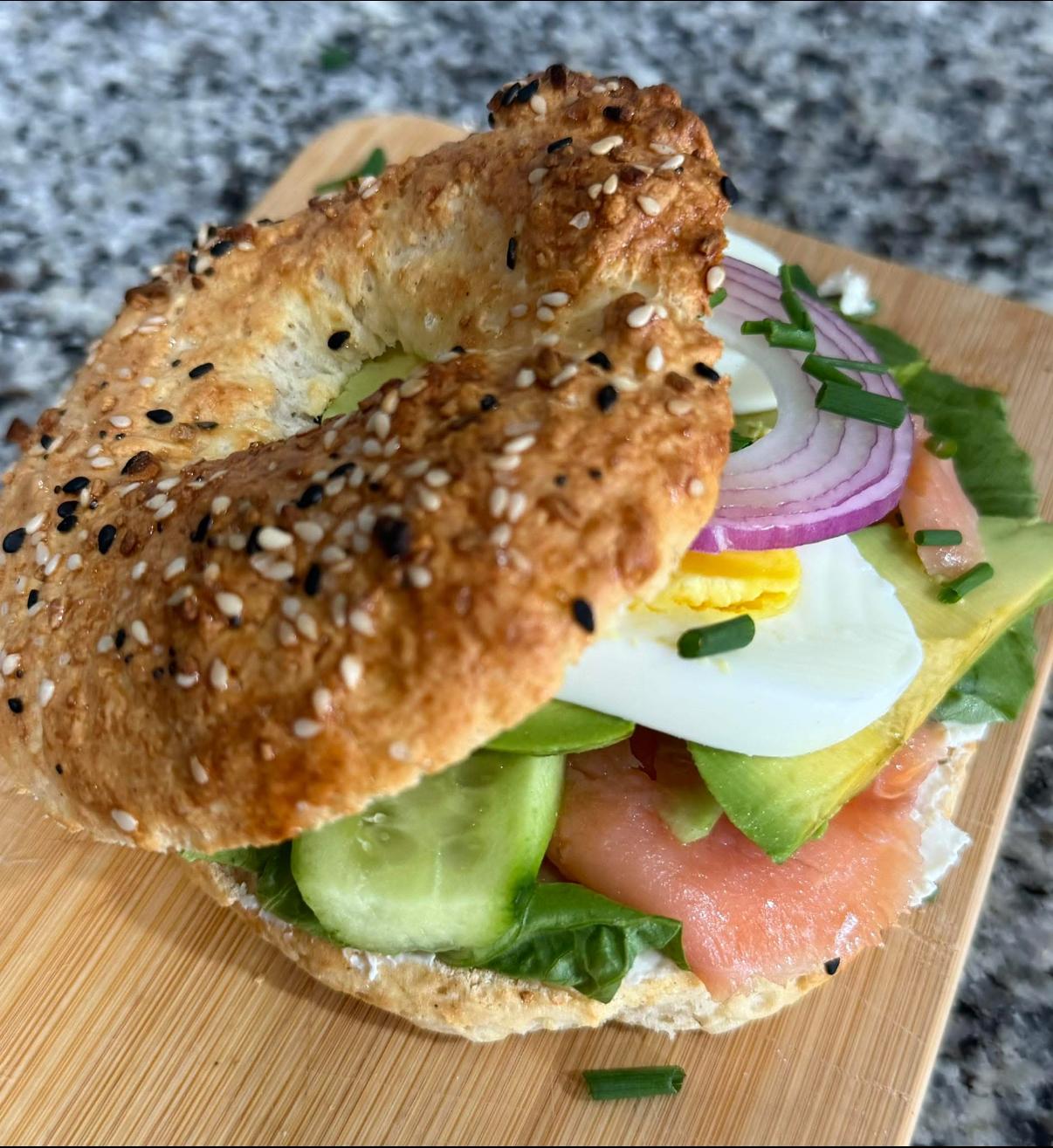 Everything gluten-free bagel sandwich with salmon, egg and avocado