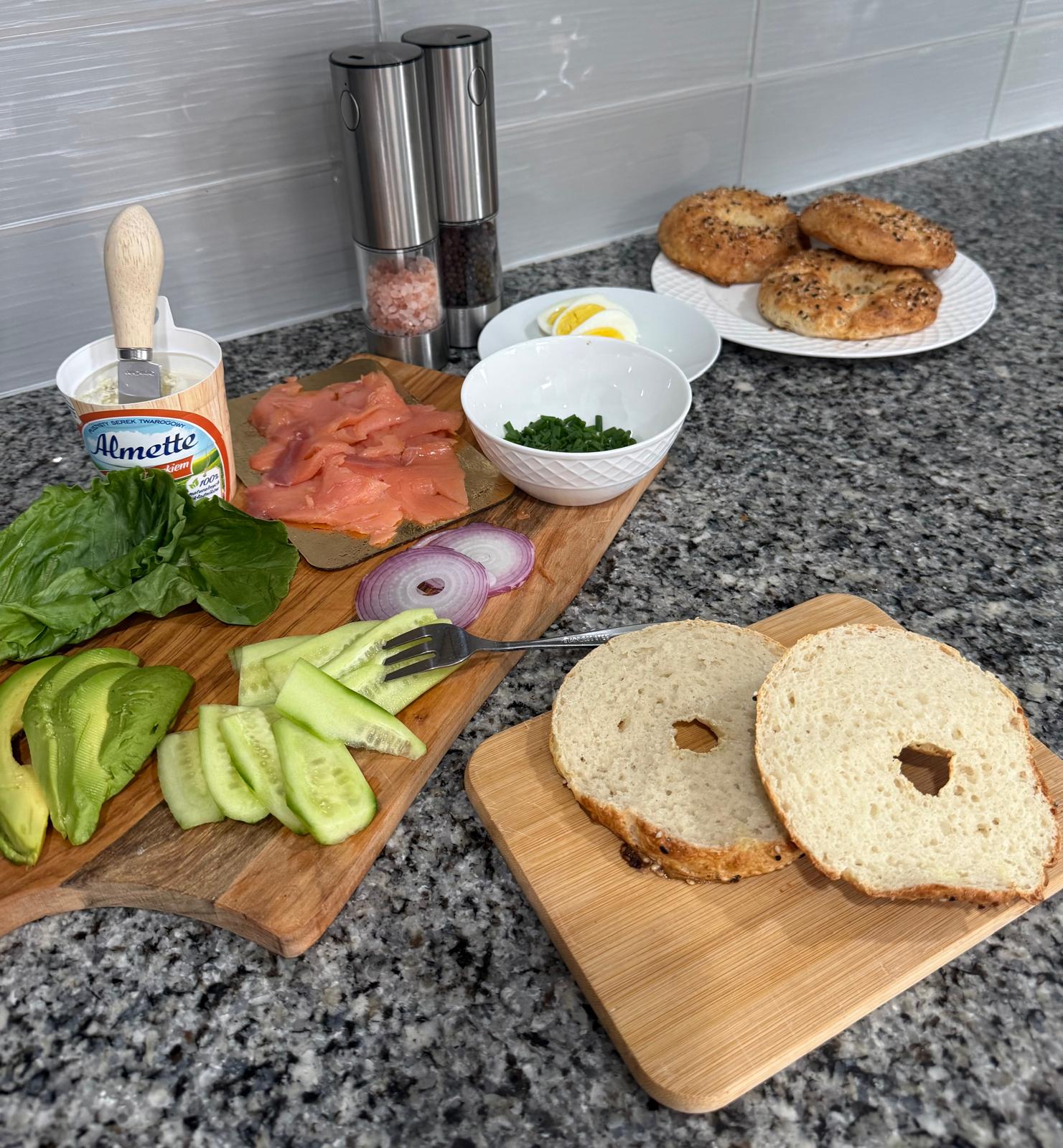 Sliced gluten-free bagels served with fresh brunch ingredients