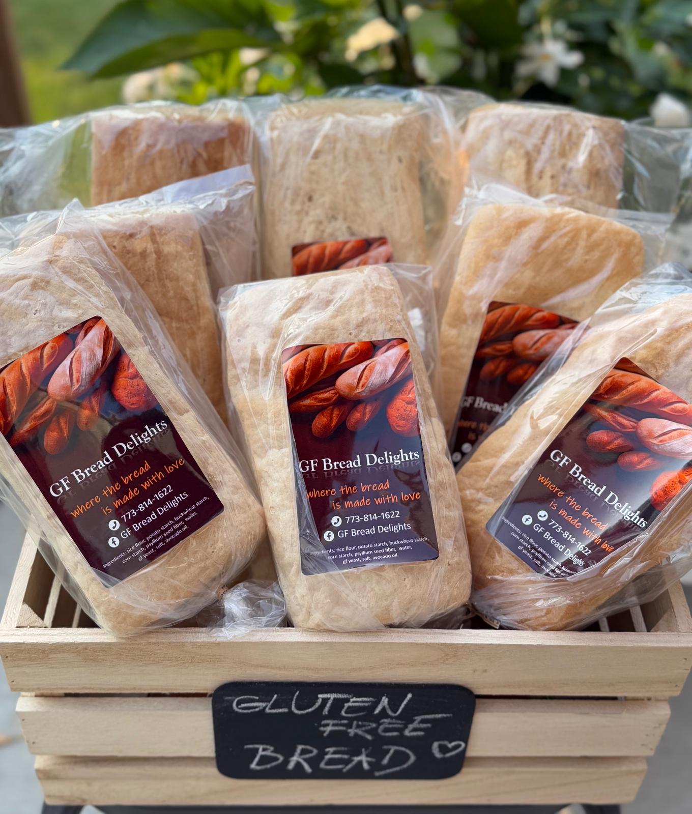 Packaged gluten-free loaves in a garden crate